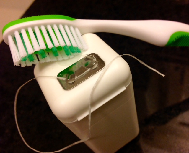 toothbrush and dental floss