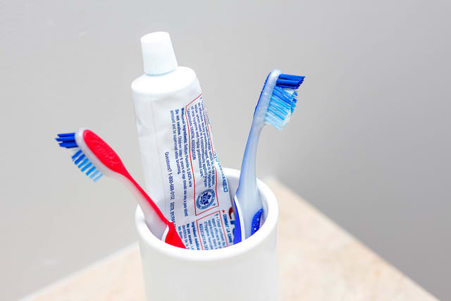 toothpaste and toothbrushes in a cup-Lorne Park Dental Associates-Mississauga Dentist